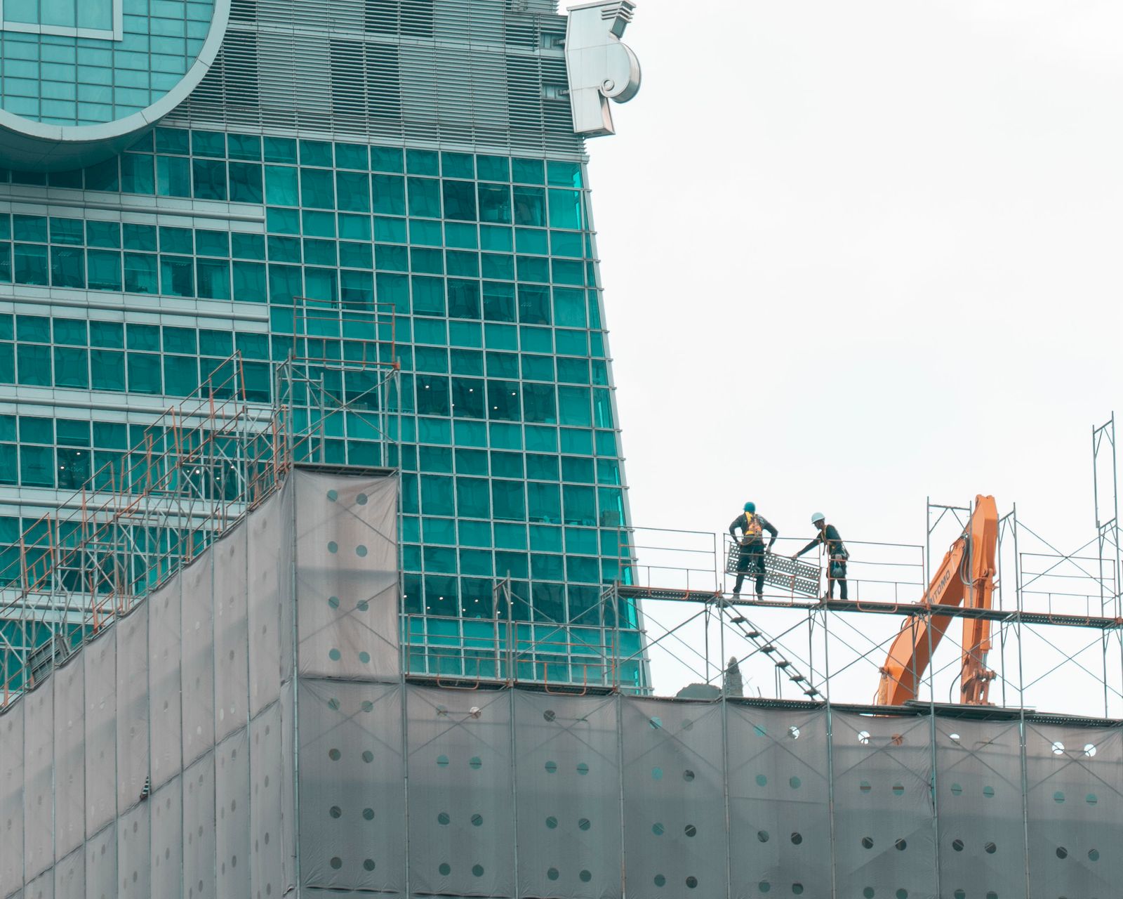 Work on a glass office tower